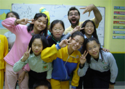 English Teacher Nick Kozac having some fun with one of his class of students
