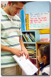 Teacher Steven with his young students in the classromm