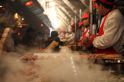 Learn about food in China. Featured image showcases food and street vendors in China.